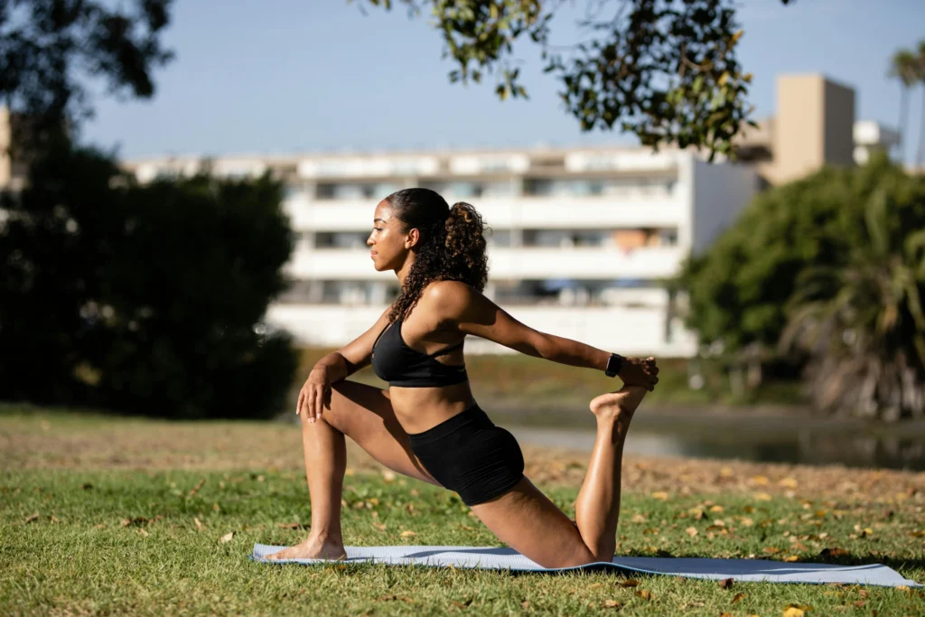 Woman doing morning yoga as part of healthy lifestyle tips
