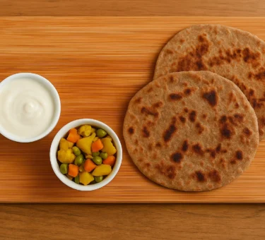 Kuttu Paratha made with Kuttu ka Atta (Buckwheat Flour) served with curd and green chutney.
