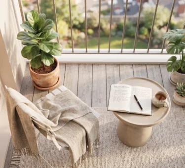 Cozy balcony garden setup with healthy potted plants and a small table.
